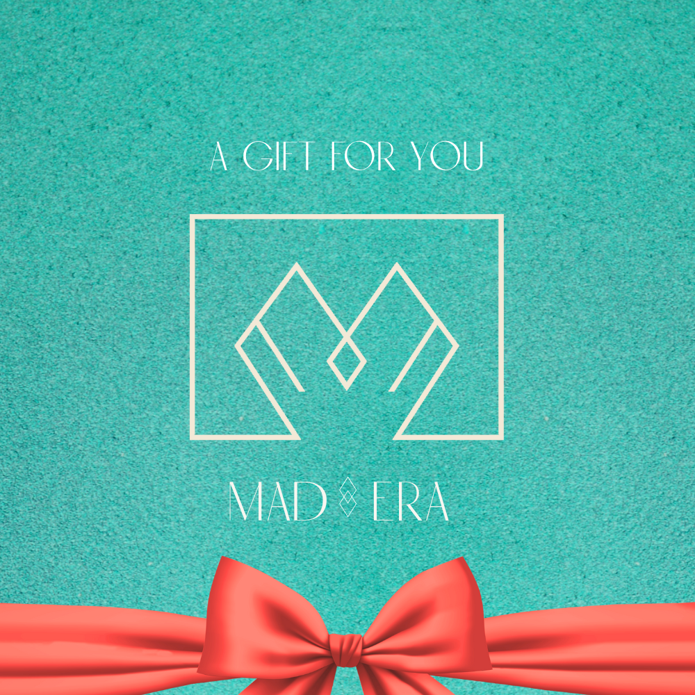 Image of a gift card in blue with an orange bow it says a gift for you Mad Era