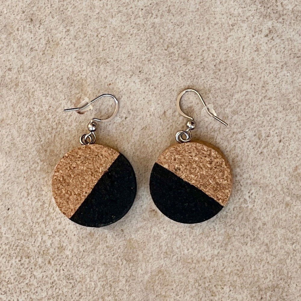 recycled cork earrings painted 1/2 black on stone background - madera-design-studio