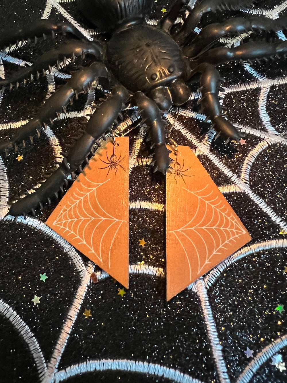 Madera Design Studio - Orange spider web pattern dangle earrings. Happy Halloween!