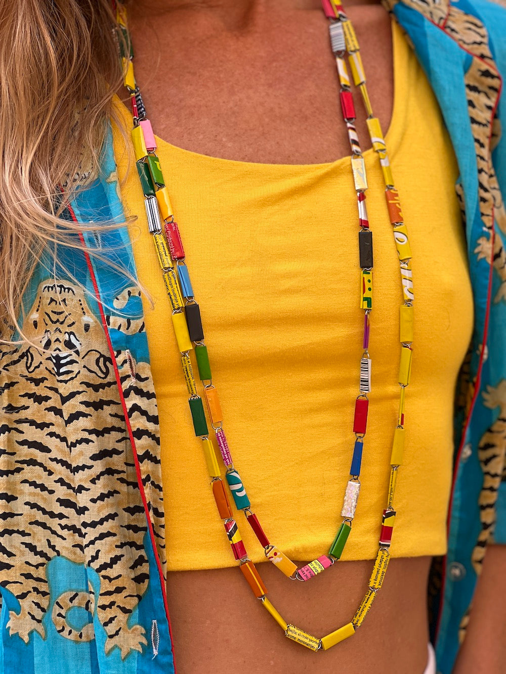 Model wearing recycled candy wrapper necklace - long colorful necklace 