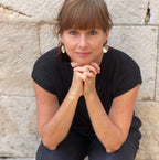 Stacey Shevlin wearing white half circle cork earrings by Justinart