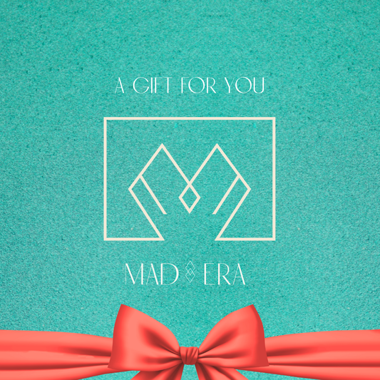 Image of a gift card in blue with an orange bow it says a gift for you Mad Era 