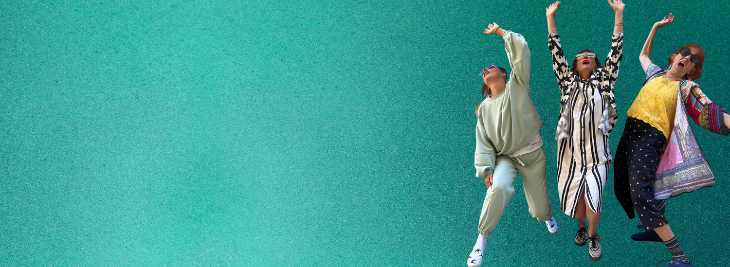 Three people in colorful outfits against a teal background