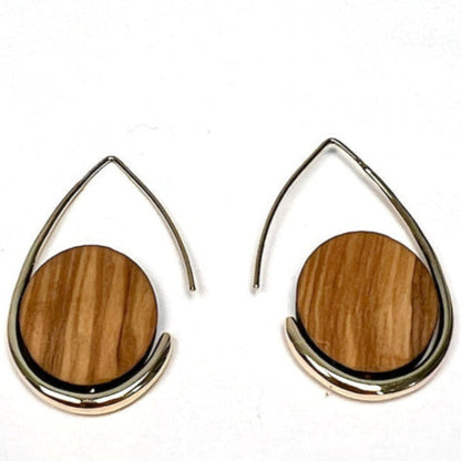 Teardrop-shaped earrings with wooden disc centers on a white background