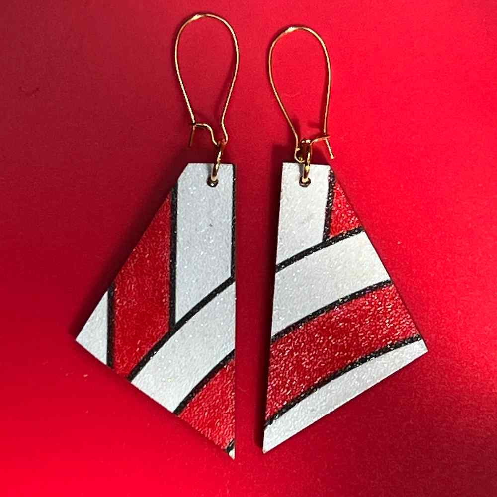 Candy Cane Earrings on red background by Madera Design Studio