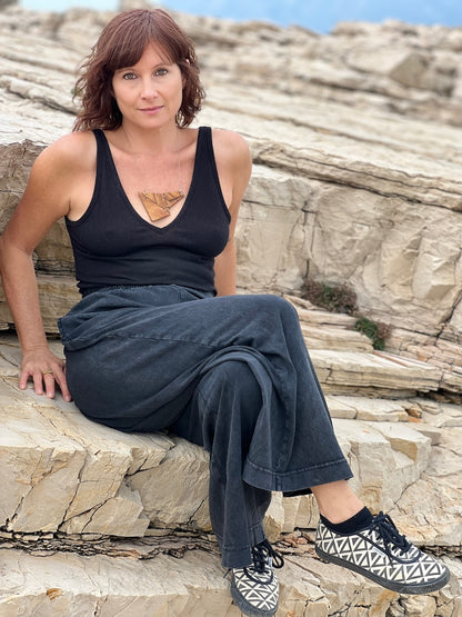 Stacey Shevlin wearing a one of a kind necklace on the beach in Croatia