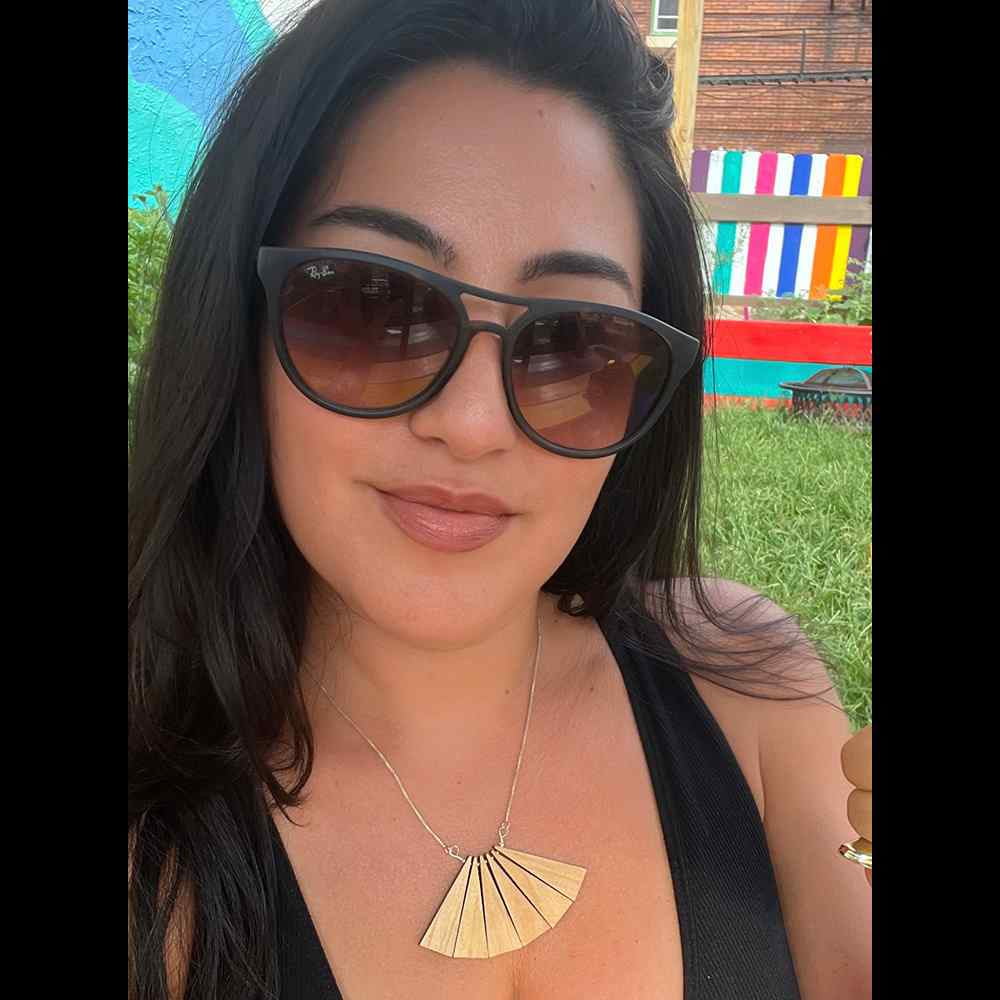 Madera Design Studio wood fan necklace on model