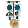 Teal earrings with gold and silver accents on a gold stand against a white background
